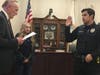 David Rodriguez is sworn in by Village President Tom Cauley at Tuesday's Village Board meeting. 