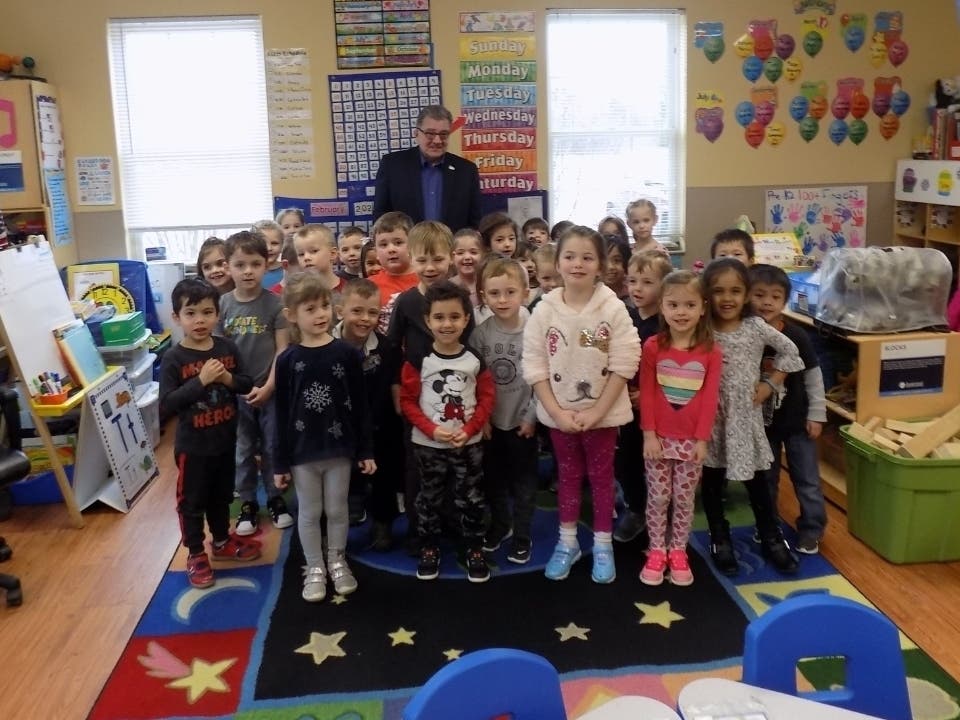 The preschoolers at The Goddard School in Darien join Darien Mayor Joseph Marchese in a photo. 