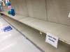 Despite a sign limiting each Jewel customer to one toilet paper package, barren shelves remain. 