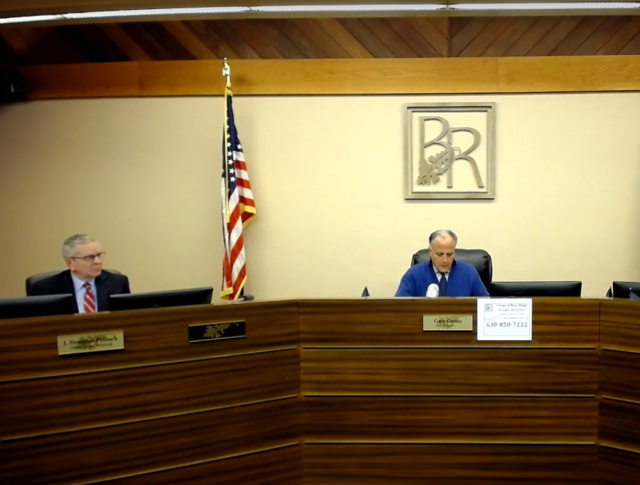 Burr Ridge Village Administrator Doug Pollock, left, has given shifting statements on whether a local restaurant is being investigated. Mayor Gary Grasso is to the right. 