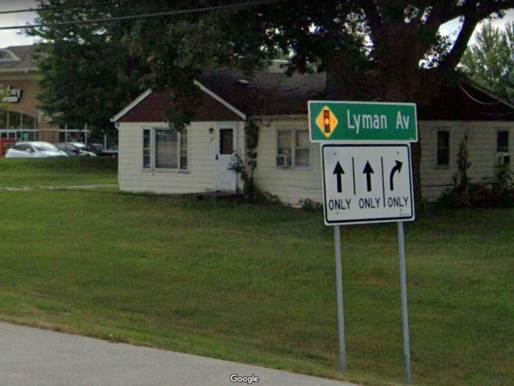 The property at 973 75th St. is unusual in that it contains an older house between a shopping center and an auto repair shop. It is proposed for a car wash. 
