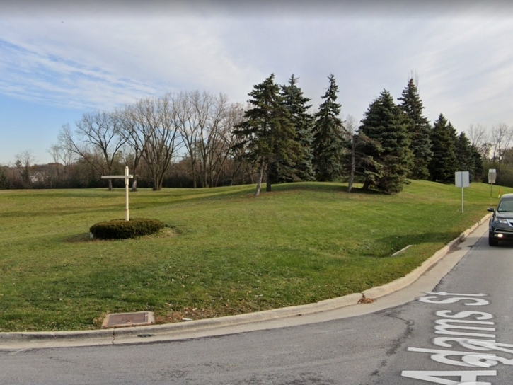 The proposed development would be at the northeast corner of Ogden Avenue and North Adams Street. The village president says neighbors have expressed opposition to the project.