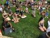 Protesters kneel or sit down for nine minutes Wednesday at the Tower Green. 