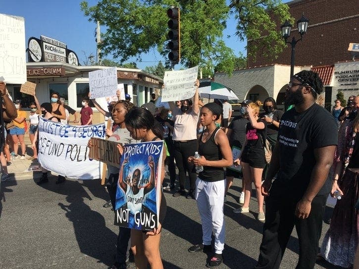 "Defund Police" was among the signs at a Black Lives Matter protest June 2 in Elmhurst. 