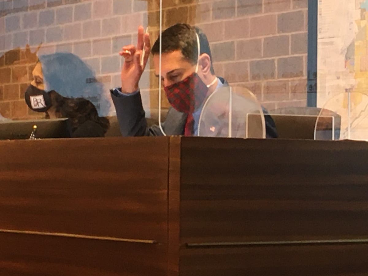 Burr Ridge Trustee Zach Mottl on Monday points out text messages from Assistant Village Administrator Evan Walter in the discussion over whether to select Walter as the interim administrator. 