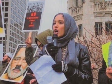 Aminah Ahmed, a junior at Hinsdale Central High School, takes part in a protest in Chicago against India's Citizenship Amendment Act, which discriminates against Muslims in the immigration system. 