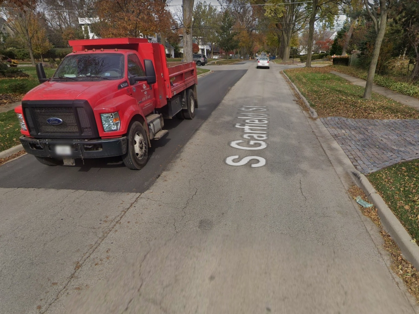 Truck traffic has taken a toll on Hinsdale's Garfield Street, officials say. The village plans to replace the asphalt with concrete in 2022. 