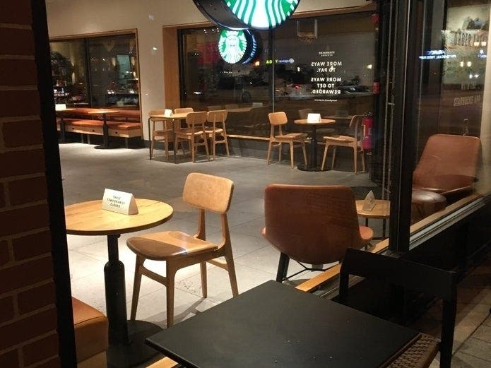 The dining rooms in most restaurants in Elmhurst, including this one at the downtown Starbucks, are closed because of the governor's order on the pandemic. 