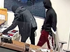 Two suspects are seen on camera early Monday morning at a Hinsdale dealership. 