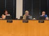 Elmhurst Development, Planning and Zoning Committee members Emily Bastedo (left), Dannee Polomsky and Mark Mulliner listen to the case made for a six-story complex at First Street and Haven Road. 