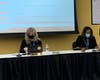 Tammy Prentiss (left), superintendent of Hinsdale High School District 86, is preparing for the beginning of Thursday's school board meeting. A number of residents later called for her removal.