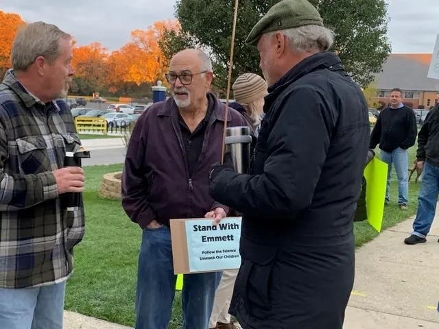 Elmhurst Alderman Mark Mulliner (center) has helped form a group that says it opposes the indoctrination of students. 