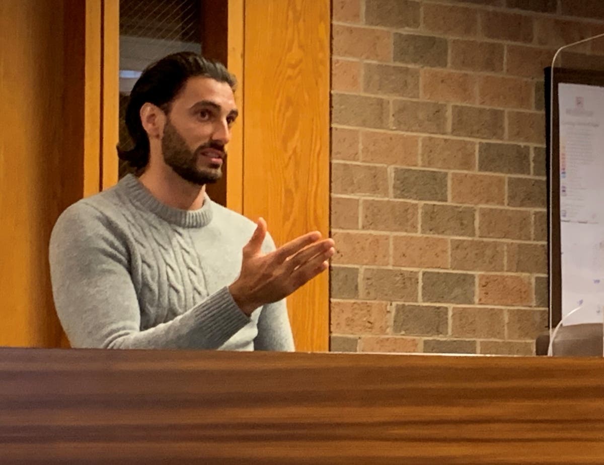 Michael Criscione, owner of M&T Truck Sales, speaks to the Burr Ridge Village Board on Monday about the business' permit. 