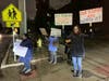 Teacher's aides at Lyons Township High School brave cold temperatures and protest for higher pay Tuesday night. 