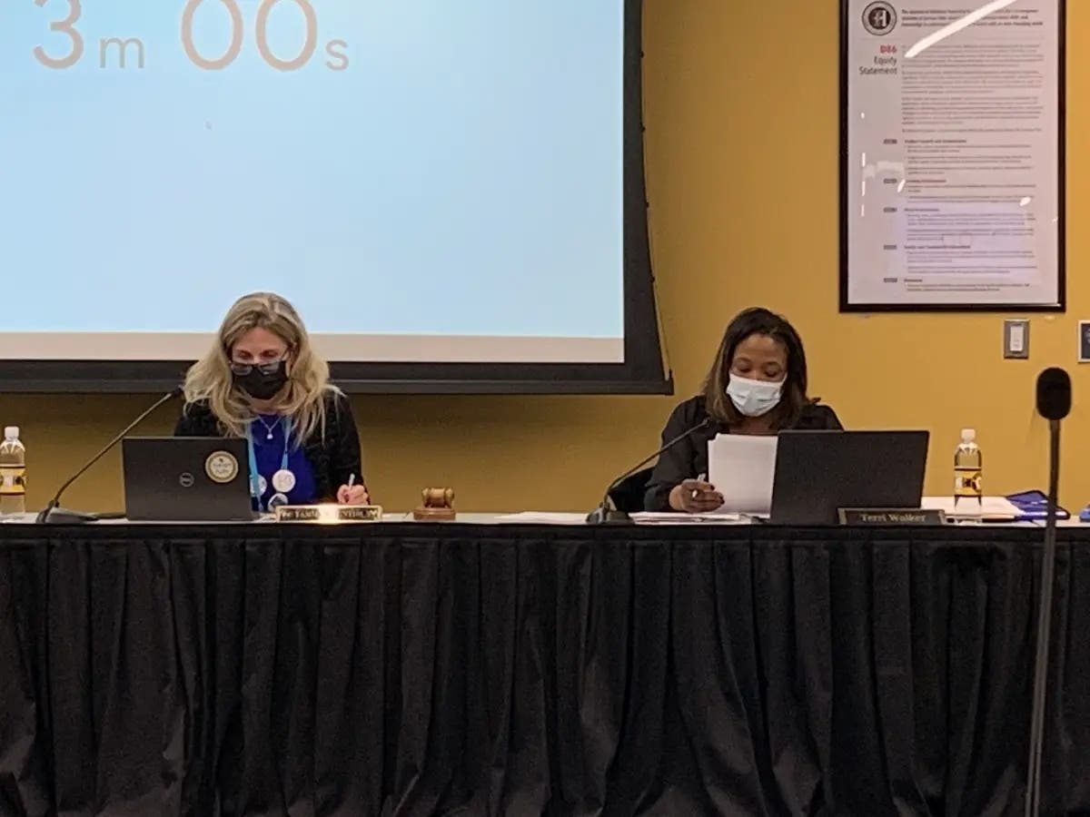 Tammy Prentiss (left), superintendent of Hinsdale High School District 86, has been criticized for reading the withdrawal letter of an anti-racism consultant. Next to her is school board President Terri Walker. 