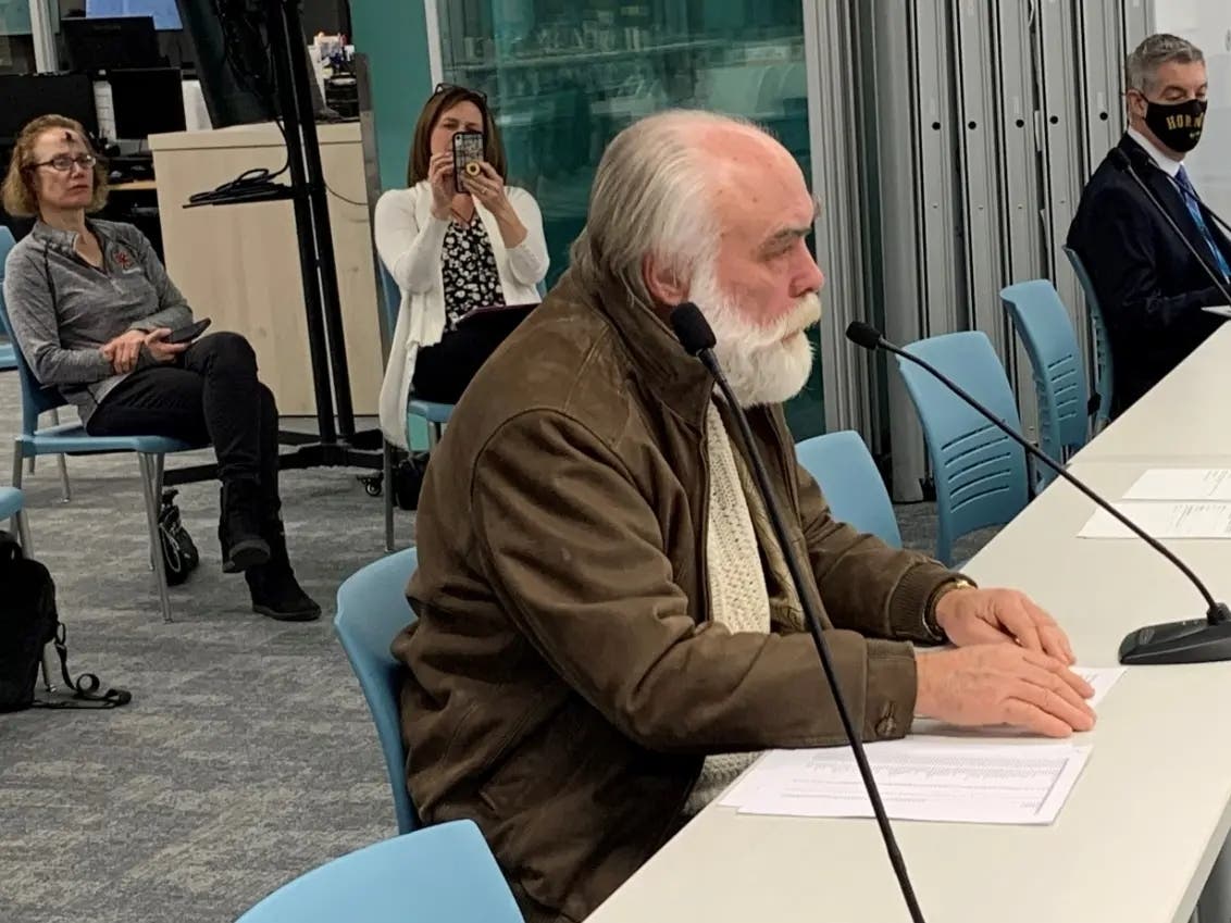 Burr Ridge resident Alan Hruby speaks at a Hinsdale High School District 86 board meeting earlier this month. He said the disparity between South and Central's course offerings is larger than officials are portraying. 