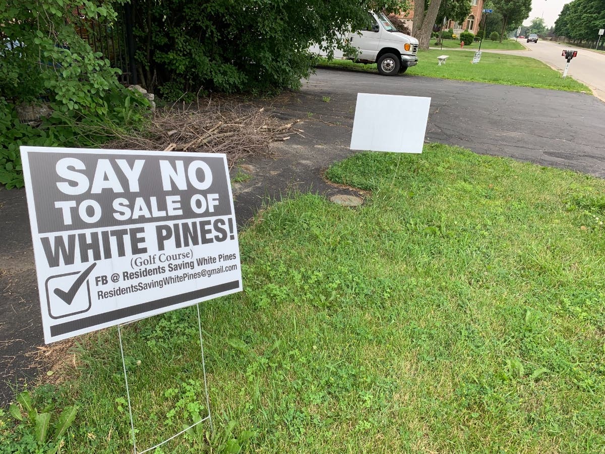 Signs opposing the sale of nearly half of White Pines Golf Club are seen in the neighborhoods near the park. The park board has yet to make a decision. 