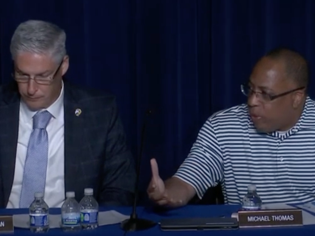 Michael Thomas (right), a Lyons Township High School board member, said Tuesday new grading polices are not working. Next to him in this video screenshot is Superintendent Brian Waterman. 