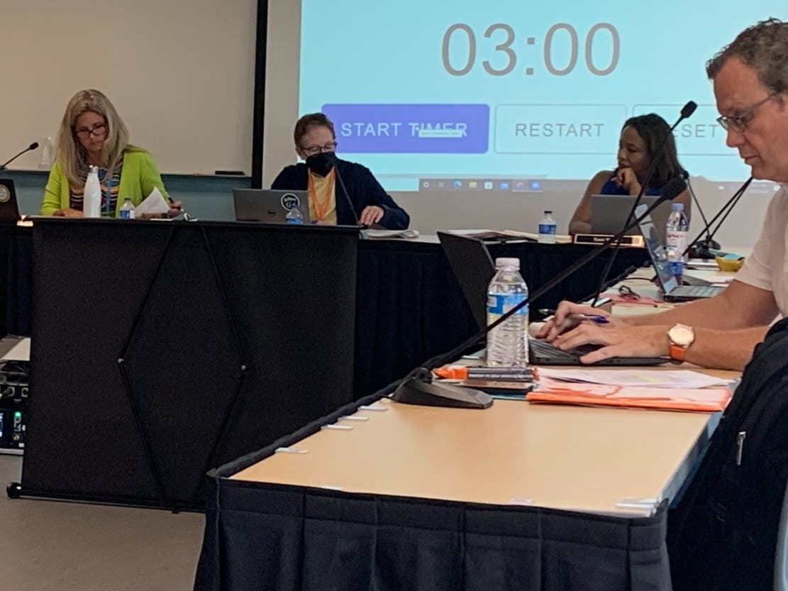 Jeff Waters (right), a member of the Hinsdale High School District 86 board, said Thursday the district's legal bills are excessive. 