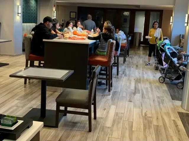 The state sent 64 Venezuelan migrants to Hampton Inn in Burr Ridge last month. The move angered many residents. 