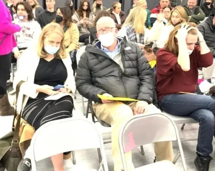 State Rep. Deanne Mazzochi, left, attends a Hinsdale High School District 86 board meeting last winter. The meeting's topic was whether to continue the district's mask mandate. 