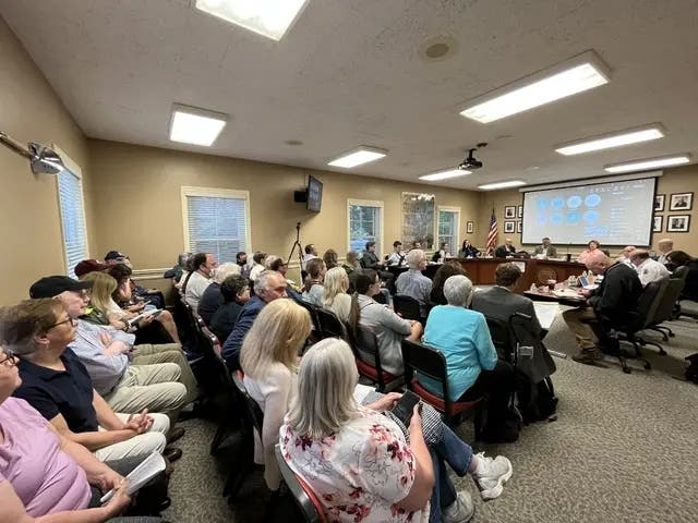 The Clarendon Village Board's meeting chambers were filled last summer with residents largely opposed to a drive-thru at a proposed Dunkin' Donuts at Western Avenue and 55th Street. In a split vote, the board rejected the drive-thru. 