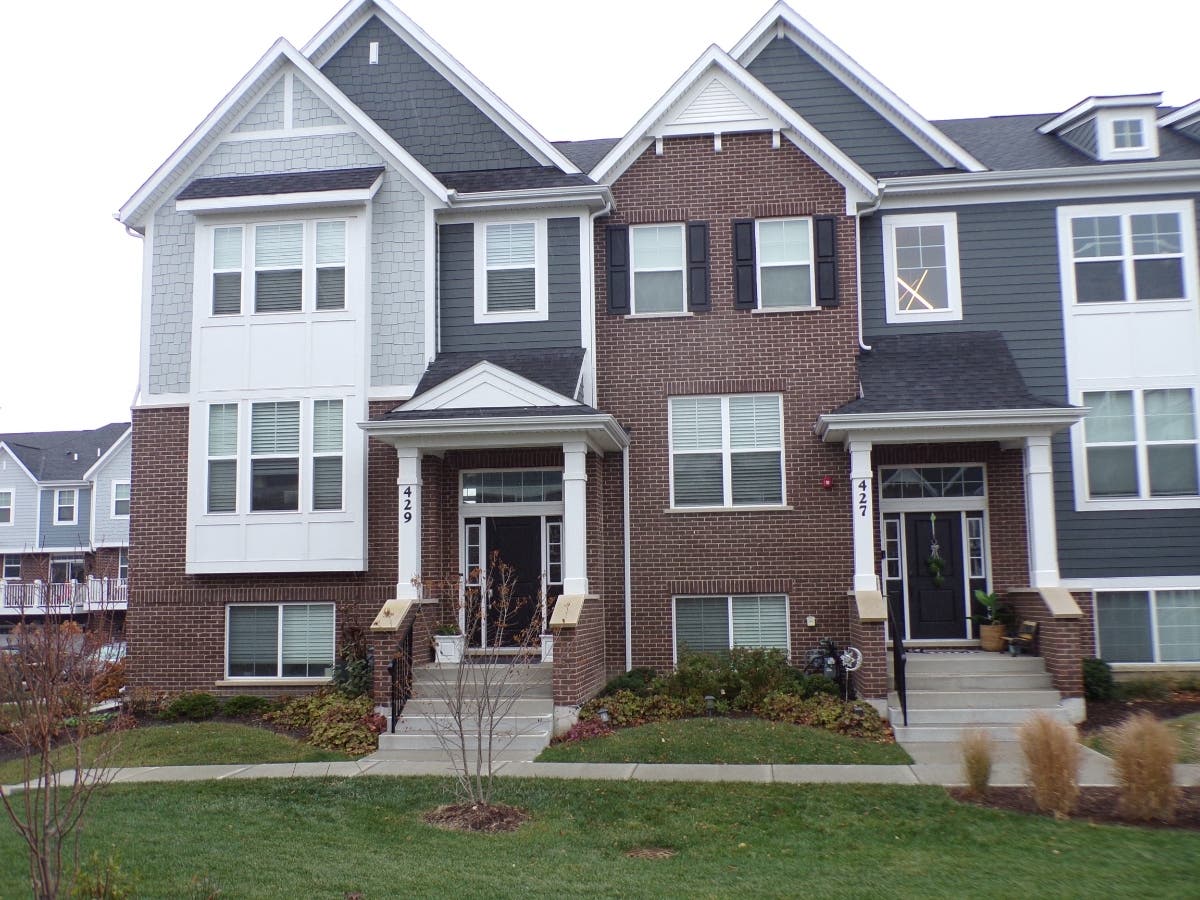 These are townhomes in the Mason Pointe development in La Grange. The townhome to the left has a property tax bill of $10,880, while the bill for the one to the right is $214.