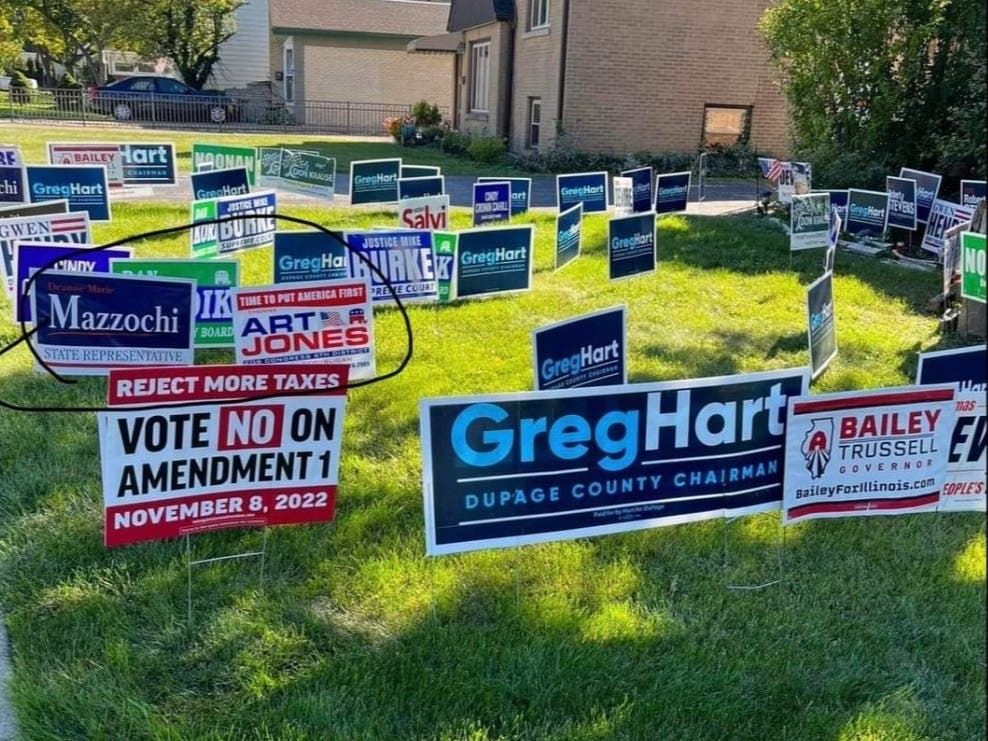 A campaign sign (circled in photo) for Art Jones, a self-avowed Nazi, was in the yard of Laura Vevers, a candidate for Elmhurst City Council. Vevers said the sign was posted without her consent. 