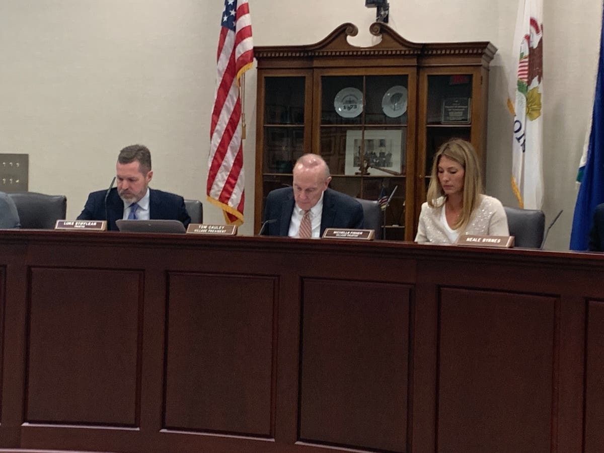 Hinsdale Village President Tom Cauley speaks Tuesday about a "very favorable" ruling for the village in its legal battle with Trinity Sober Living. Next to him are trustees Luke Stifflear and Michelle Fisher. 