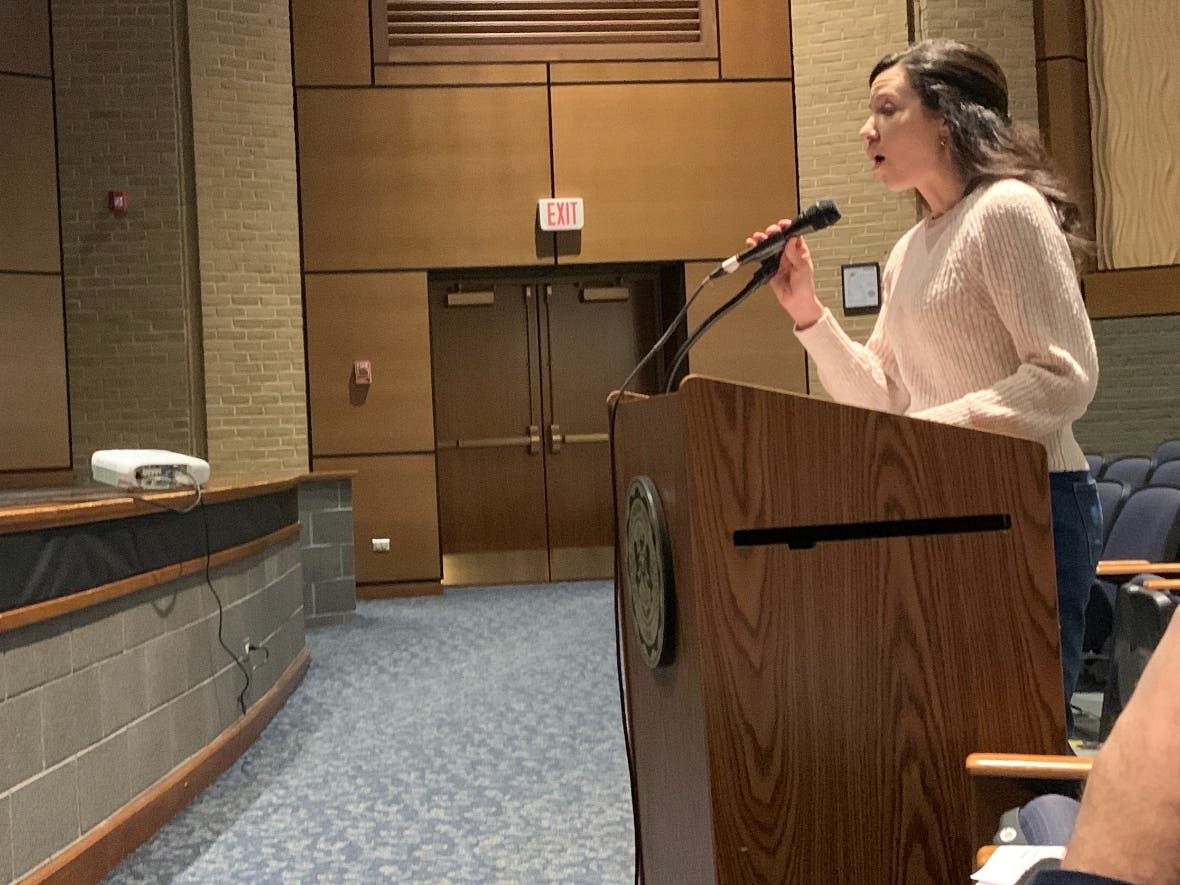 Resident Jennifer Houch speaks at Lyons Township High School's board meeting Monday against a plan to sell the school's land to an industrial developer.