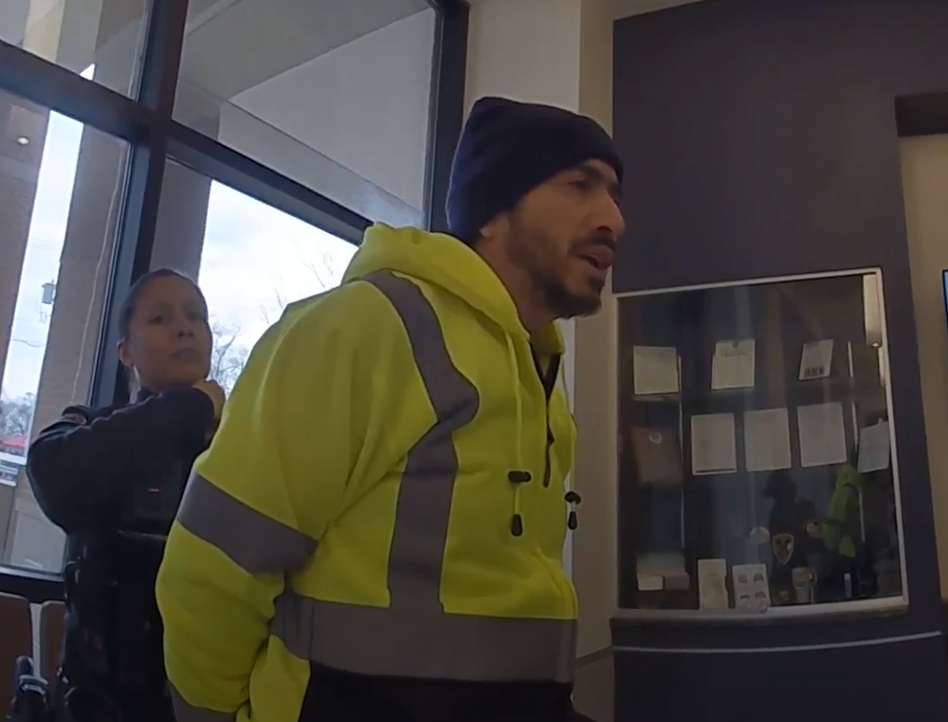 Dimas Carmona, husband of Bensenville Trustee Rosa Carmona, is seen in a screenshot of a police video being arrested March 21 at the local police station. He was accused of battering the husband of an opponent. 