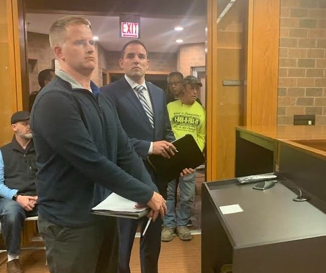 QuikTrip's Andrew Smith (left) and QuikTrip attorney John Simpson make the case to the Village Board on Monday for a proposed truck stop just outside Burr Ridge's boundaries. The board voted unanimously against the project. 