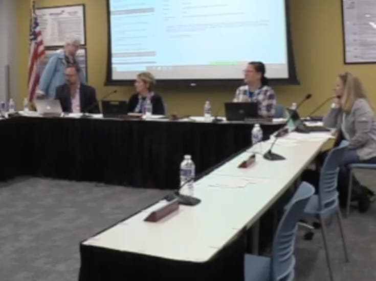 In a screenshot of a meeting video, Kay Gallo, a member of the Hinsdale High School District 86 board, is seen walking away from Thursday's board meeting. She resigned minutes later. 