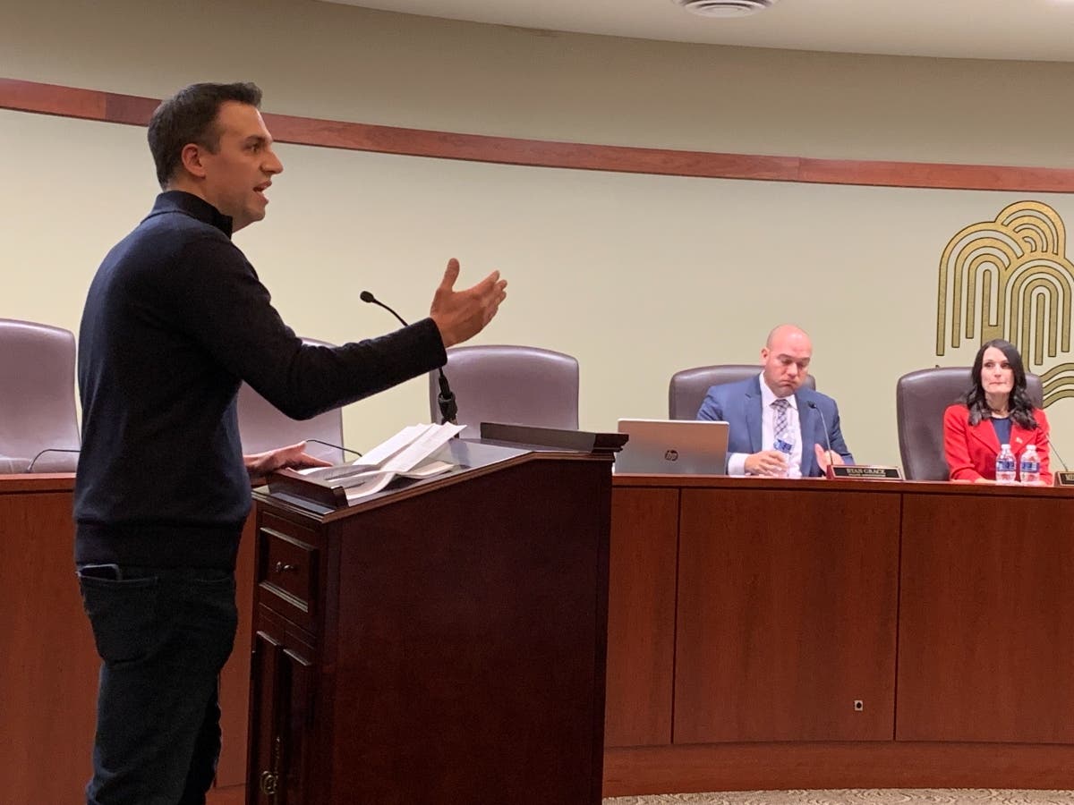 Willow Springs resident Jim Distasio expressed his opposition Tuesday to how Lyons Township High handled a land deal. He spoke at a Willow Springs town hall. In the background are Village Administrator Ryan Grace and Village President Melissa Neddermeyer.