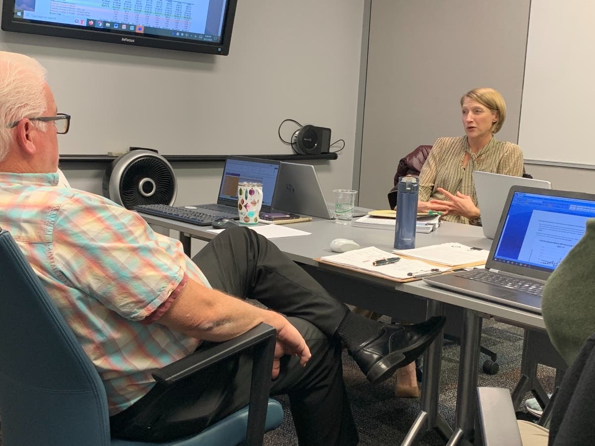 Elmhurst Alderwoman Noel Talluto (right) acknowledges Monday that the "sticker shock" of proposed water and sewer rate increases would be extreme. In the foreground is Alderman Rex Irby. 