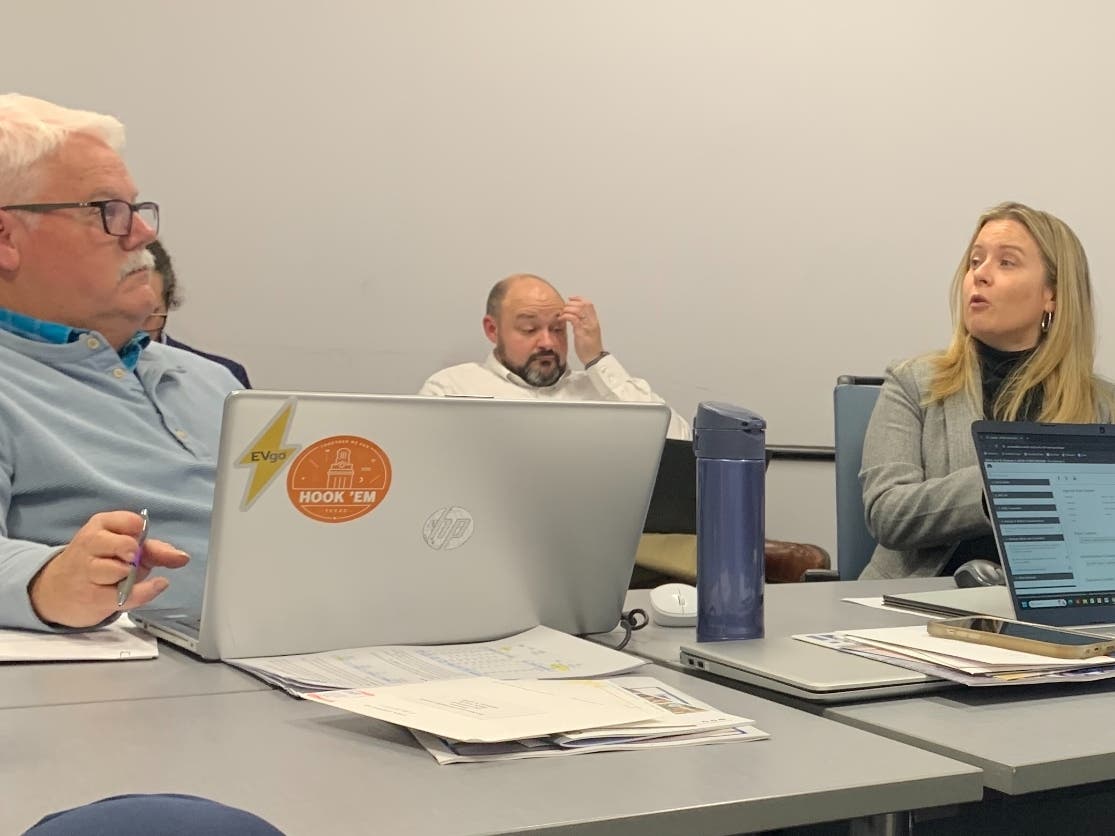 Christina Coyle (right), Elmhurst's finance director, said Monday that the city may go out to bid for the new train station in June. Next to her at the table is Alderman Rex Irby. 