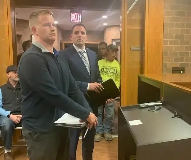 QuikTrip's Andrew Smith (left) and QuikTrip attorney John Simpson make the case to the Burr Ridge Village Board on Oct. 23 for a proposed truck stop just outside the village's boundaries. The board voted unanimously against the project. 
