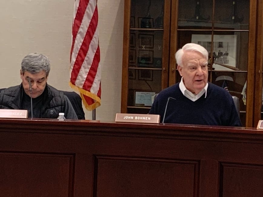 John Bohnen (right), chairman of the Hinsdale Historic Preservation Commission, on Wednesday criticizes the design of a house in the Robbins Park Historic District. Next to him is commission member Frank Gonzalez. 
