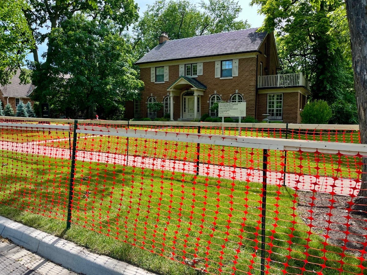 A construction-type fence was put around the trees in the parkway in front of the house at 292 S. Arlington Ave., which the owners plan to demolish. No permit has been granted yet. 