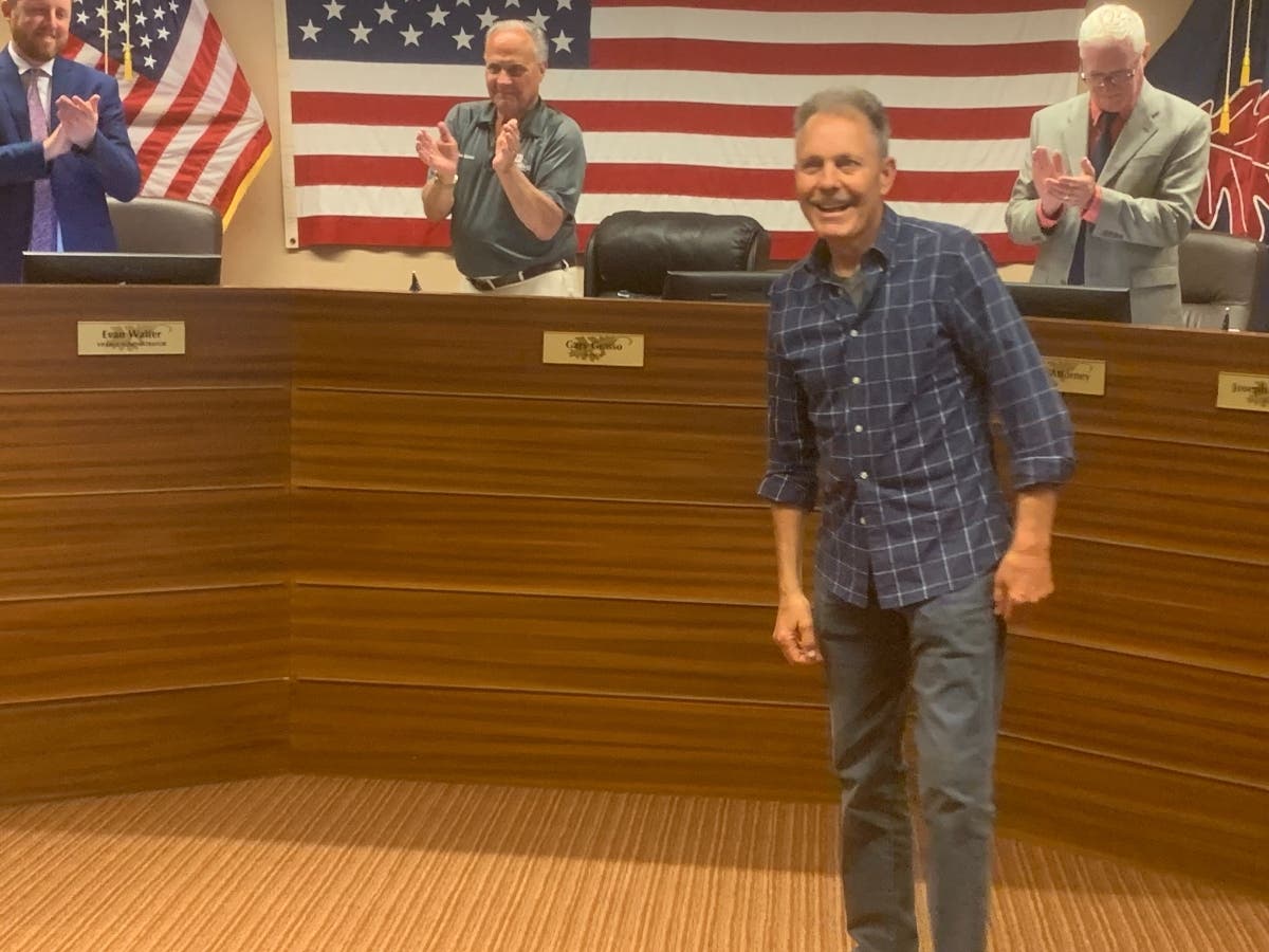 Burr Ridge officials applaud village employee John Wernimont at Monday's Village Board meeting for his four decades of service. He said he plans to work for another year or two. 