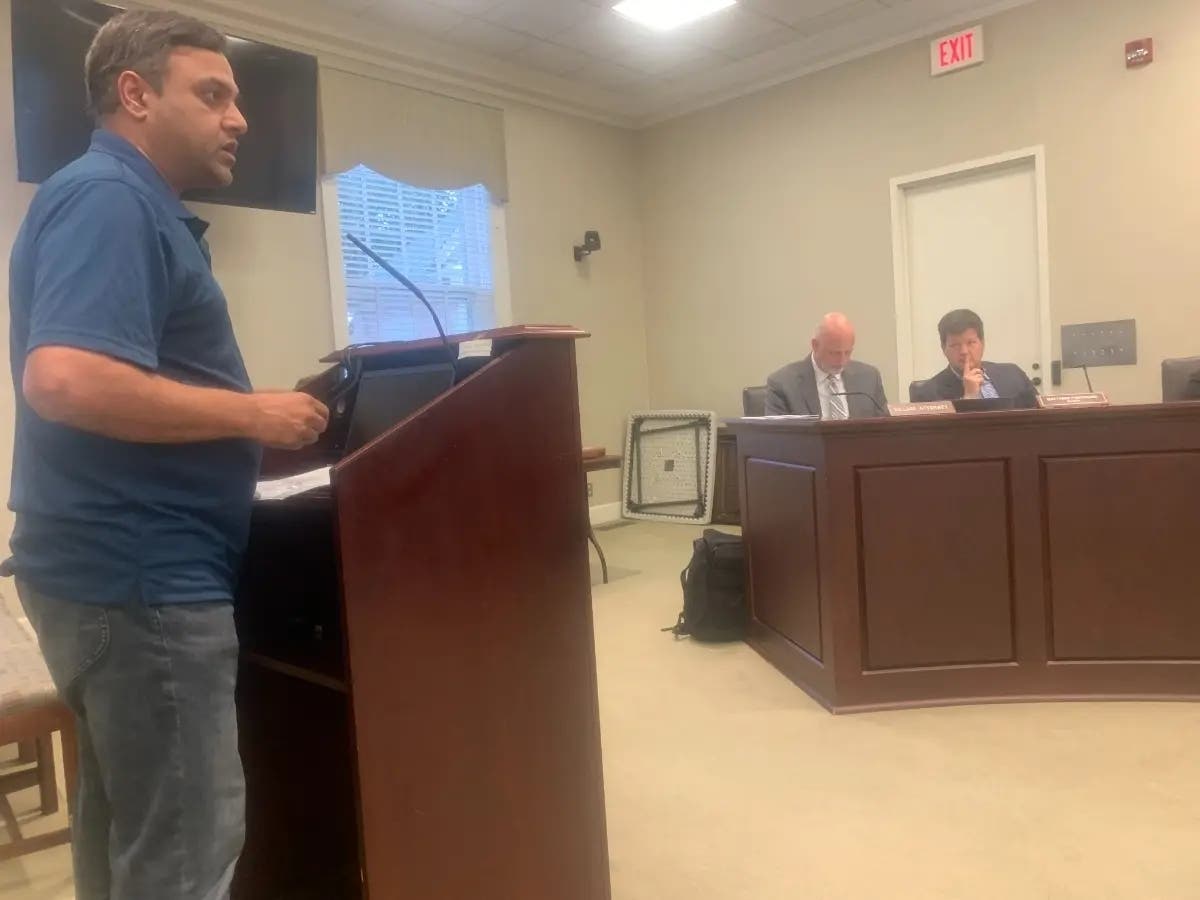 Hinsdale resident Rahul Visal speaks in July to the Village Board about the proposal to ban short-term rentals that are less than three months. He recommended a one-month threshold.