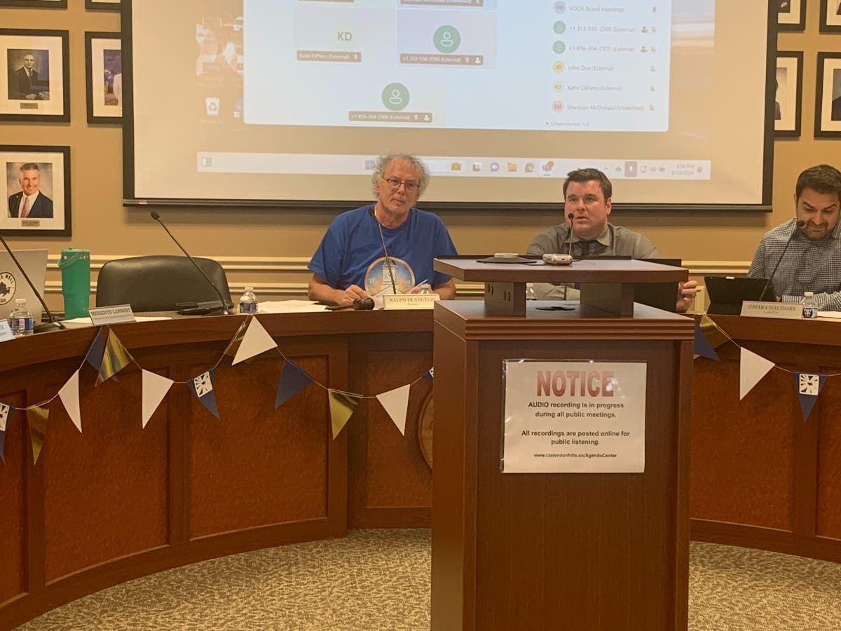 Trustee Ralph DeAngelis (from left), Village Manager Zach Creer and Trustee Omar Chaudhry take part Monday in a Village Board meeting.