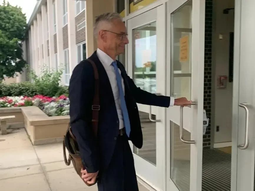 Hinsdale High School District 86 is a big client for Robbins Schwartz attorney Joseph Perkoski. The firm may be losing the business. He appears here earlier this summer entering Hinsdale South High School for a closed meeting. 