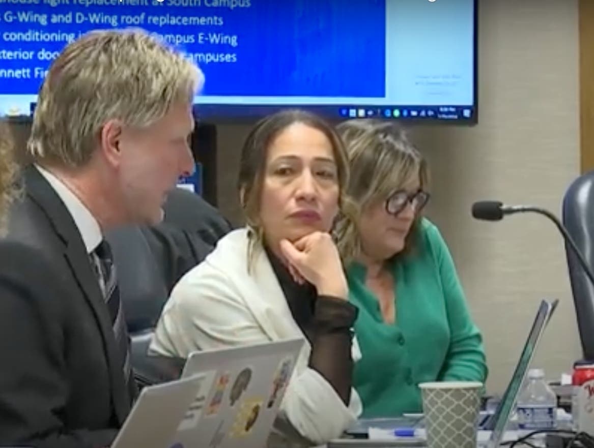 Elvia Nava (in white), a member of the Lyons Township High School board, has resigned because she is moving away, the school said. 