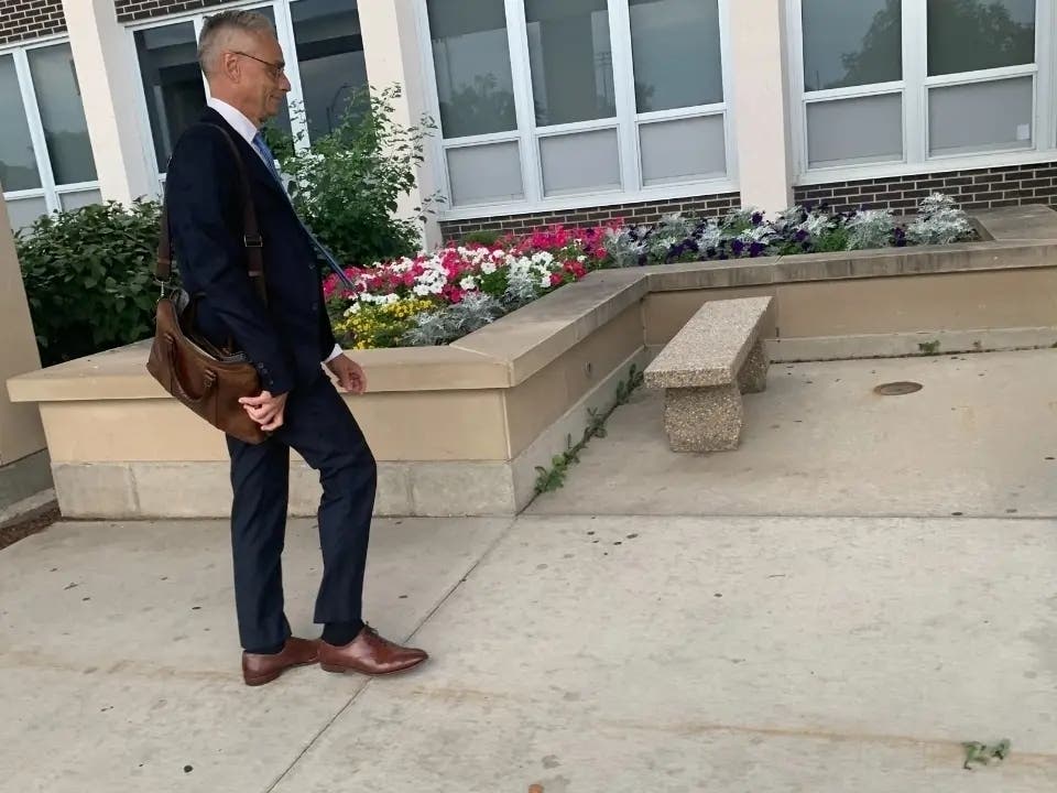 Joseph Perkoski, an attorney with Robbins Schwartz, enters Hinsdale South High School in June, just in time for a closed school board session. He was the main lawyer representing District 86. 