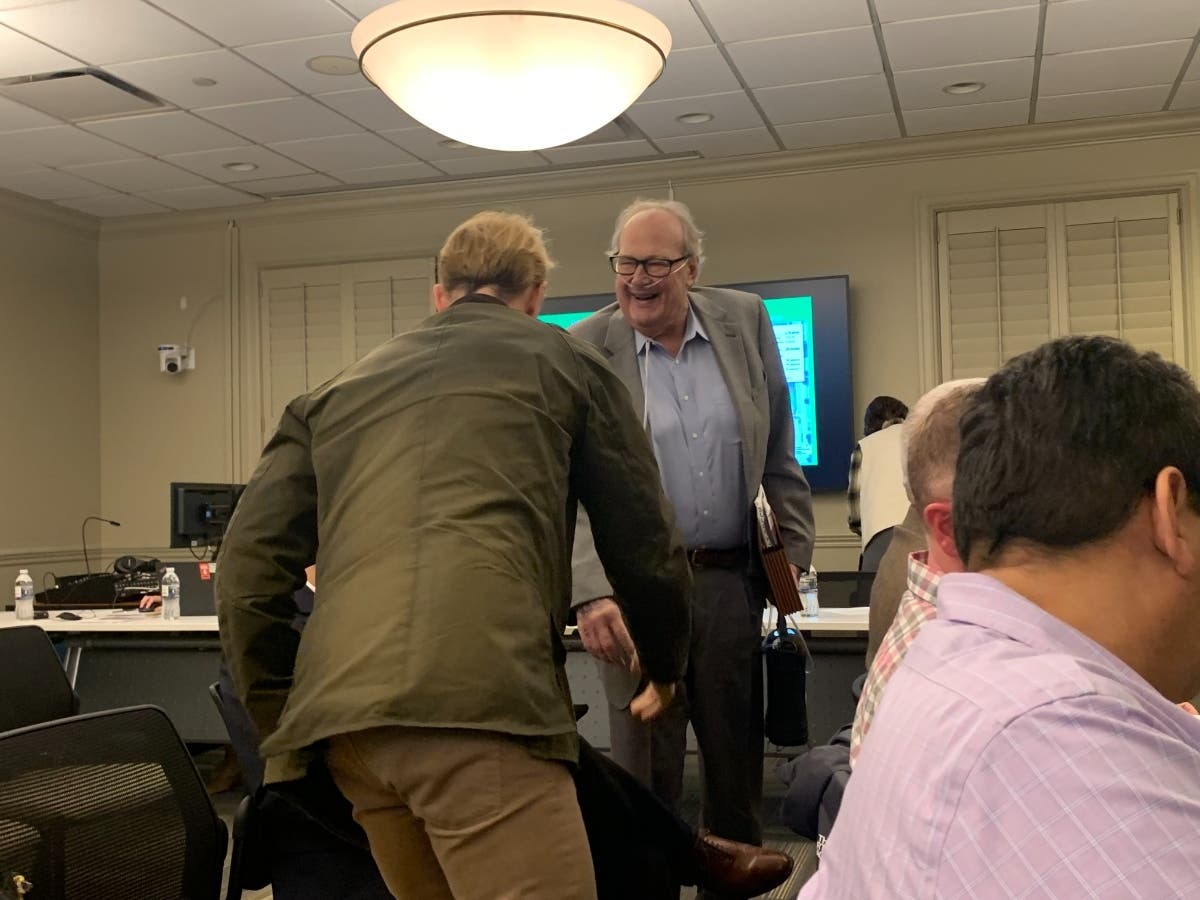 Paul McNaughton, president of Burr Ridge-based McNaughton Development, greets people before Monday's Western Springs Plan Commission meeting. The commission recommended his townhome development.