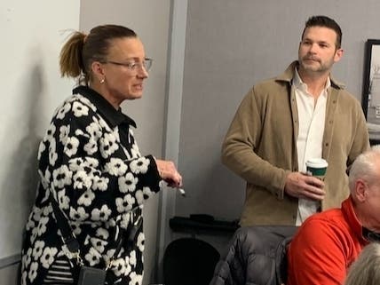 Michelle Dwyer, a resident on Elmhurst's Shady Lane, encourages city officials on Monday to stick to their plan for a stormwater project in her neighborhood. Near her is resident David Czerwinski, who also spoke up. 