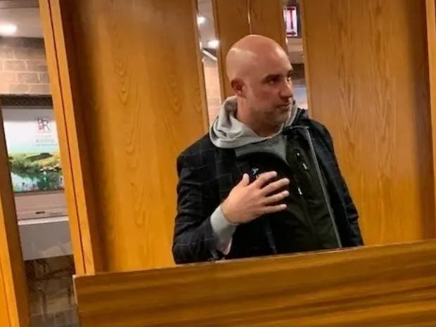 Craig Cassell of commercial real estate firm Cushman & Wakefield speaks to the Burr Ridge Village Board in November about the offer from client Goddard School to buy the Village Hall building.