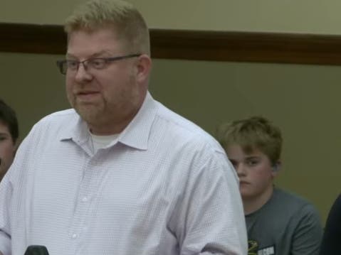 Kurt Volkman, chairman of La Grange's Design Review Commission, warns officials against adopting a resolution opposing state legislation on housing. 
