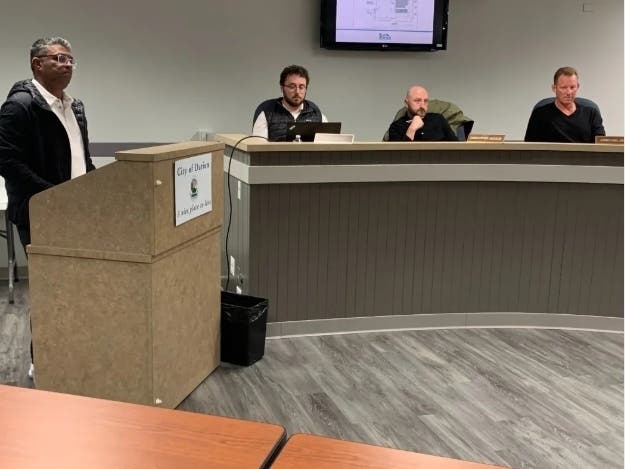 Vick Mehta, owner of Indvestia Capital, speaks in May 2025 to the Darien Plan Commission. Looking on (from left) are city planner Ryan Murphy and commissioners Christopher Jackson and Jonathan Johnson.